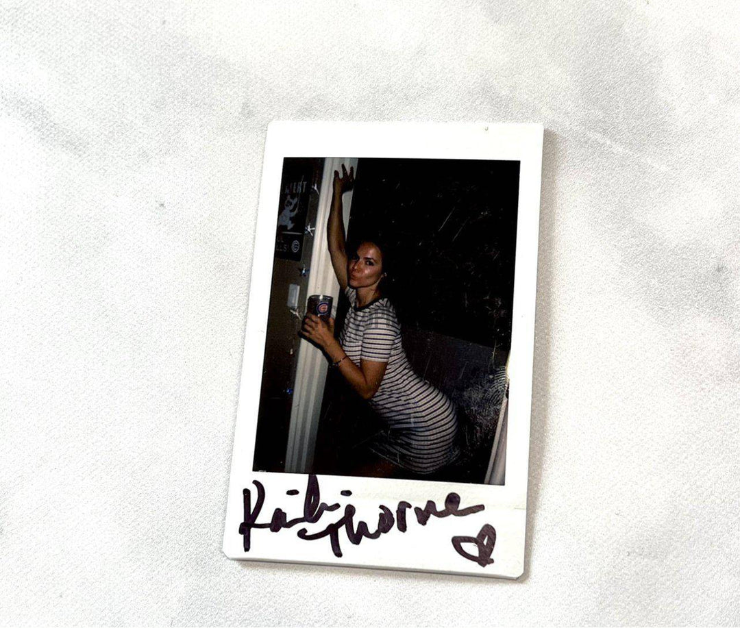 Kaili Thorne Autographed Stripped Dress Polaroid - Fans Utopia